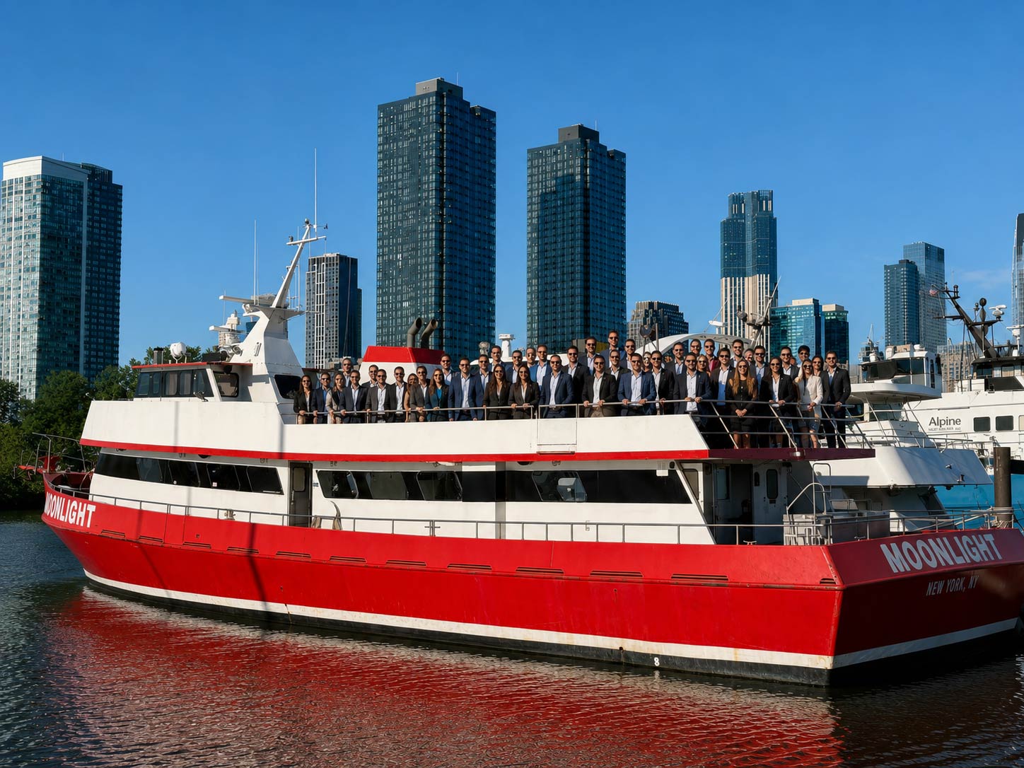 Corporate group posing on a yacht